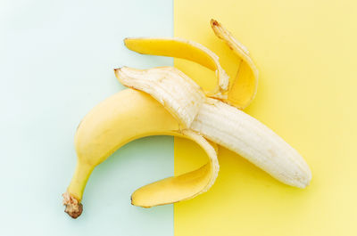 High angle view of banana on colored background
