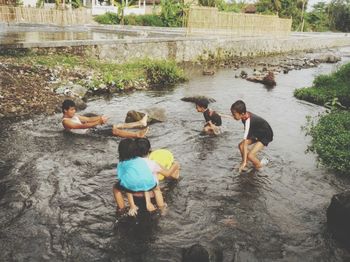 High angle view of people in lake