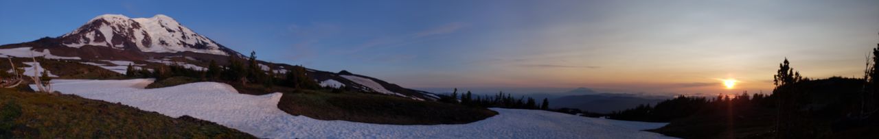 Panoramic view of snowcapped mountains against sky during sunset