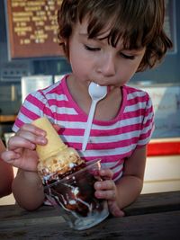 Close-up of girl holding icecream cone