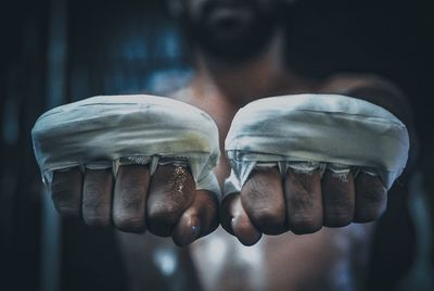 Close-up of boxer hands with bandages