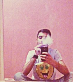 Midsection of woman photographing with mobile phone