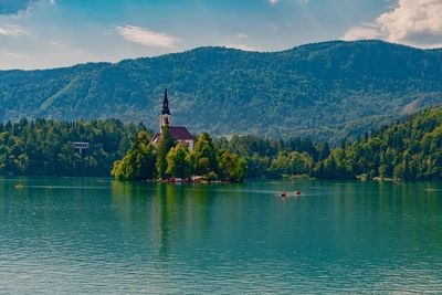 Scenic view of lake against cloudy sky