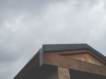 Low angle view of built structure against cloudy sky