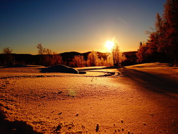 Scenic view of landscape at sunset