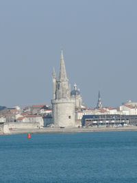 View of cathedral in sea against clear sky