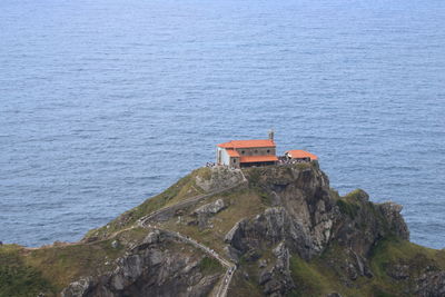 Scenic view of sea against rock