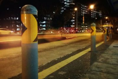 Close-up of yellow street at night