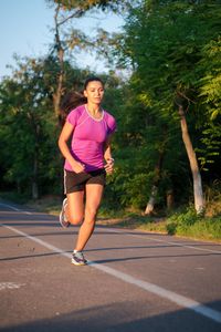 Woman running on road