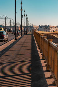 View of bridge in city against clear sky