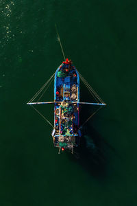 High angle view of ferris wheel in river