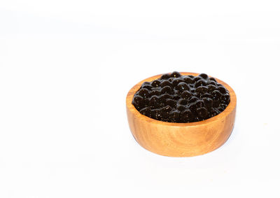 High angle view of black coffee against white background