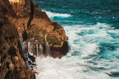 Scenic view of rocks in sea