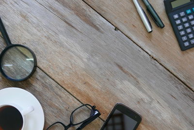 High angle view of sunglasses and laptop on table