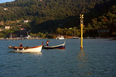 Man on boat against trees