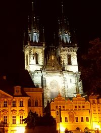 Low angle view of illuminated building against sky at night