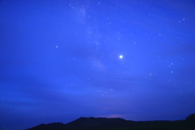 Low angle view of blue sky at night