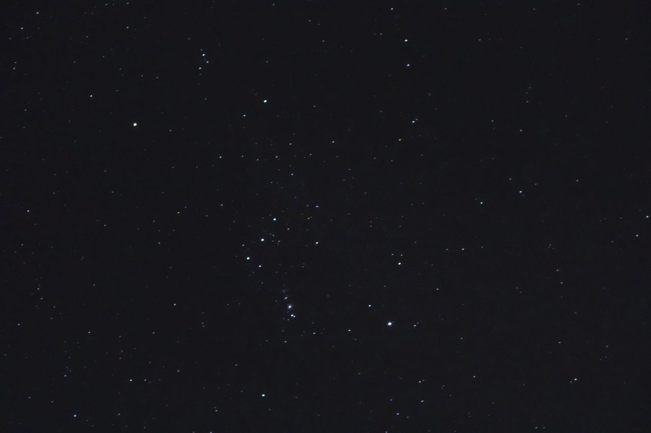 LOW ANGLE VIEW OF STAR FIELD AGAINST SKY