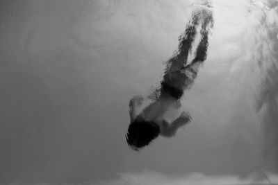 Low angle view of boy swimming in water