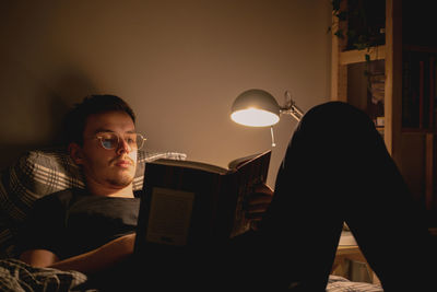 Man reading in bed