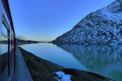 Scenic view of mountains against clear blue sky