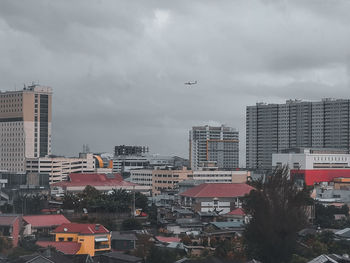 Buildings in city against sky