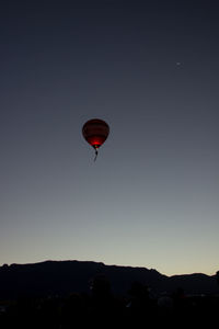 Low angle view of hot air balloon against clear sky