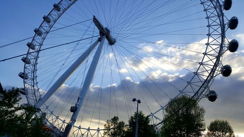 Low angle view of ferris wheel against sky