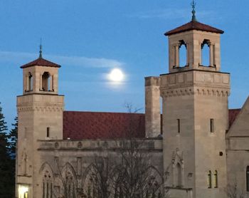 Low angle view of church against blue sky