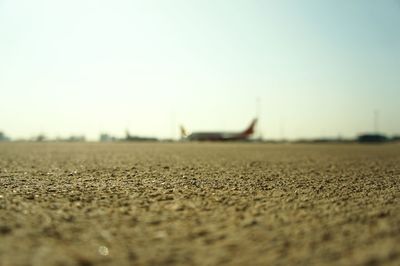 Surface level of landscape against clear sky