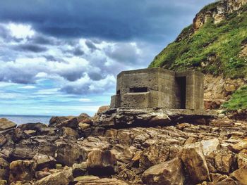 Old ruins of building against cloudy sky