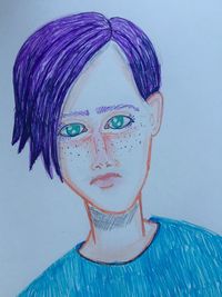 Close-up portrait of young woman against white background