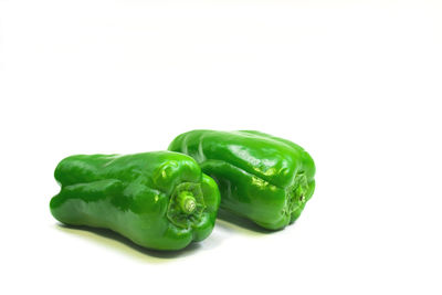 Close-up of green bell pepper against white background