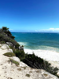 Scenic view of sea against blue sky