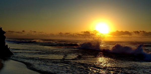 Scenic view of sea against clear sky during sunset