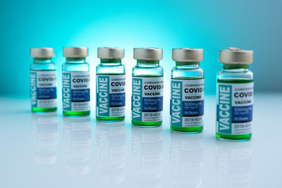 Close-up of bottles against blue background