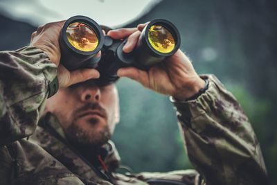 Soldier looking through binocular