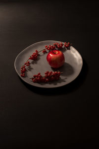 High angle view of fruits in plate on table
