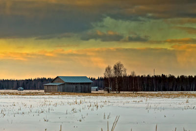 House against sky during sunset