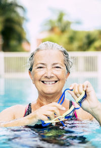 Portrait of man swimming in pool