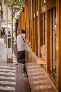 Cute girl looking through window