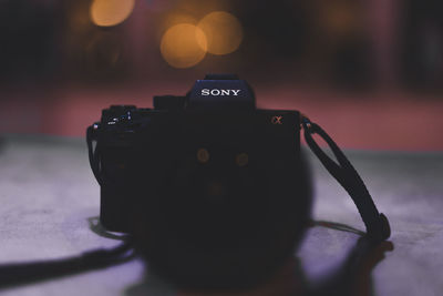 Close-up of camera on table