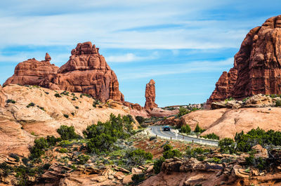 Rock formations against cloudy sky