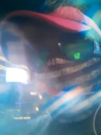 Close-up portrait of man reflection on glass