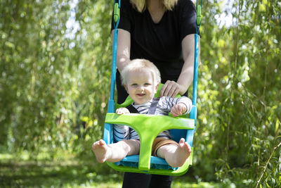 Full length of father and daughter in park