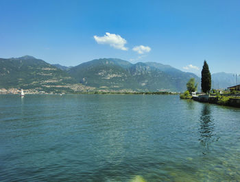 Scenic view of mountains against blue sky