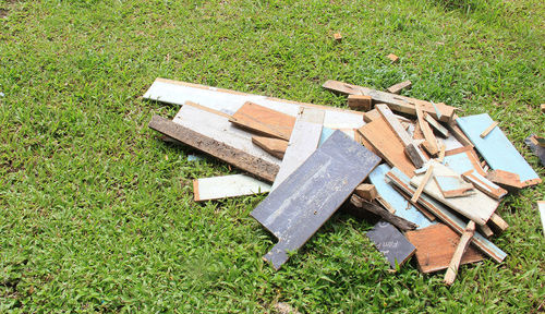 High angle view of old bench in field