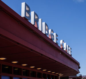 Low angle view of illuminated building against sky