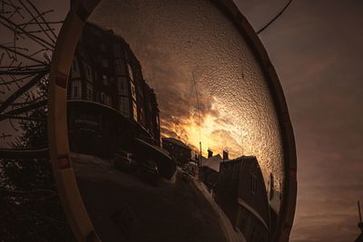 Low angle view of silhouette buildings against sky during sunset