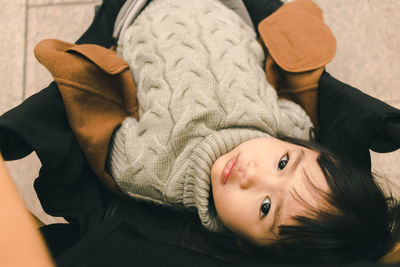 High angle portrait of cute boy relaxing at home